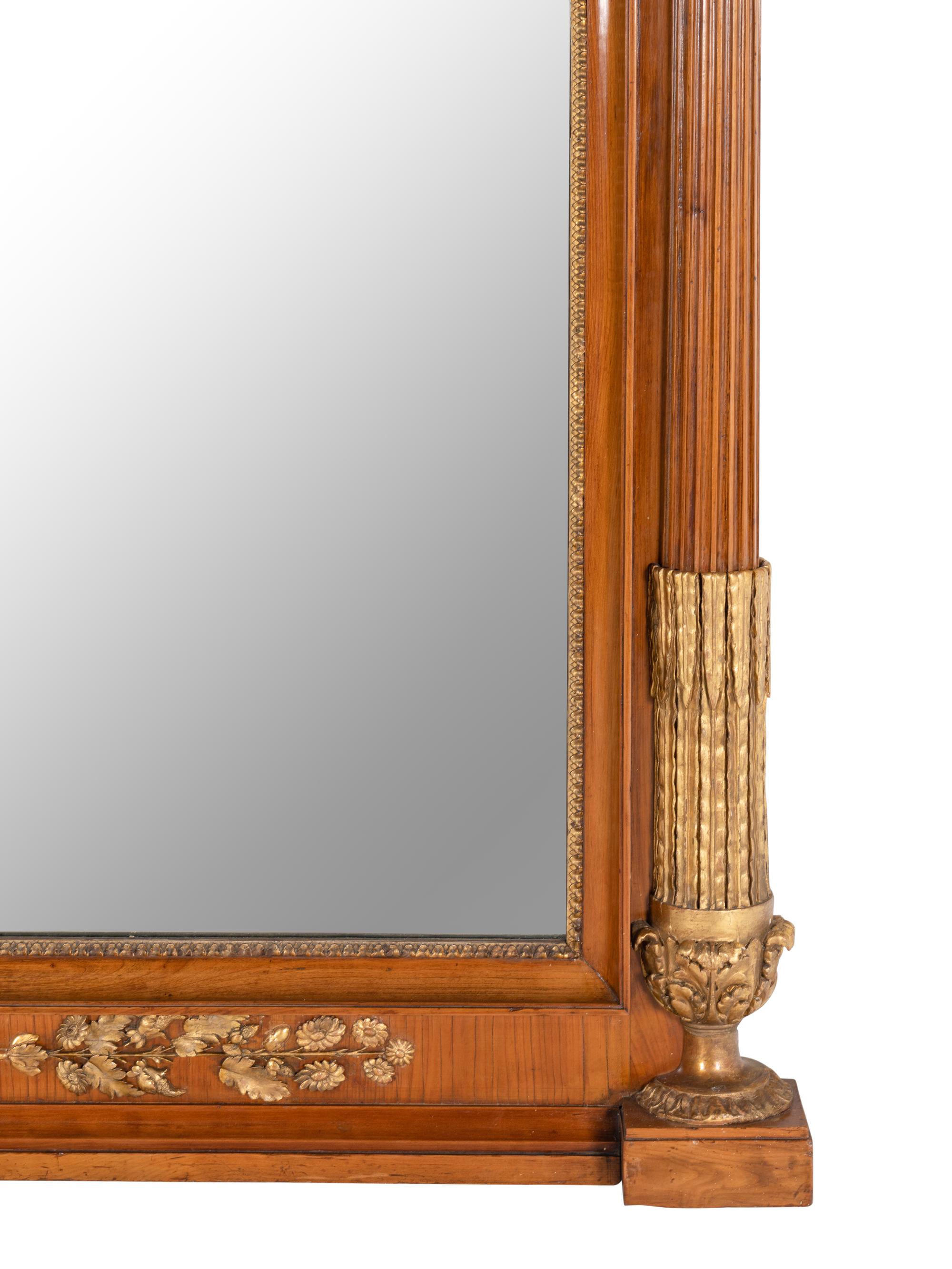 An Empire Style Parcel-Gilt Mahogany Mirror