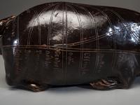 An Anna Pottery Incised and Brown Glazed Pig Flask