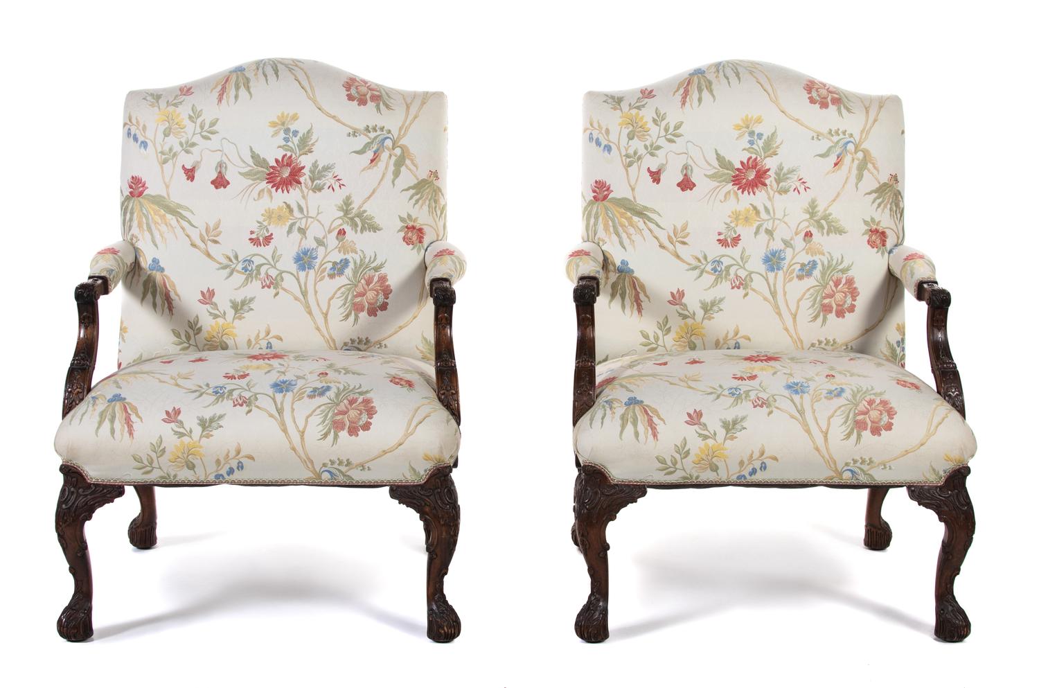 A Pair of George III Style Carved Mahogany Library Armchairs
