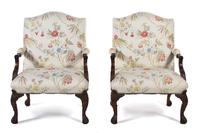 A Pair of George III Style Carved Mahogany Library Armchairs