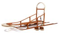 A Dog Sled and a Pair of Eskimo Shoes Length of sled 106 inches.