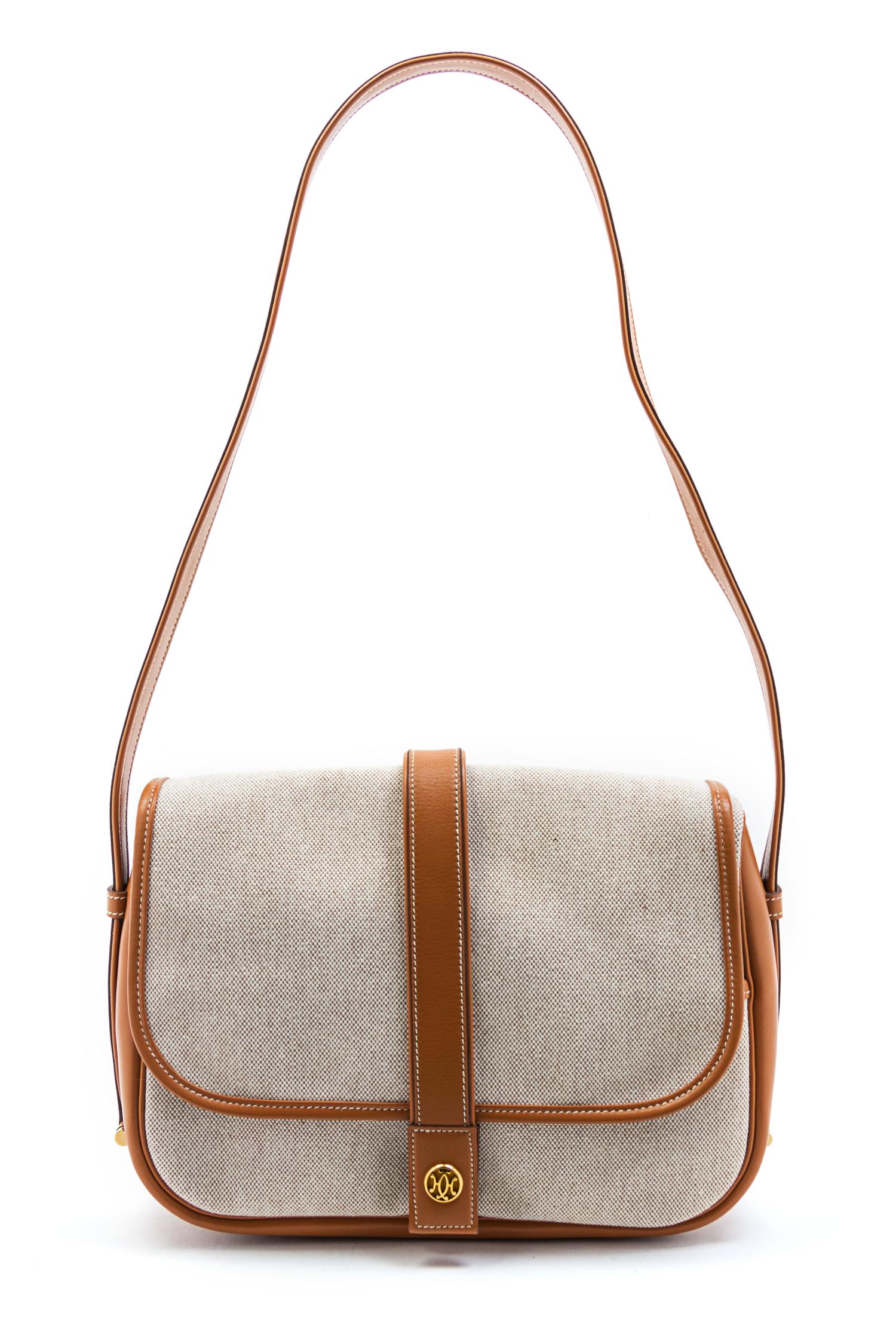 An Hermes Canvas and Brown Leather Trim Shoulder Bag, 11 x 8 x 3 inches.