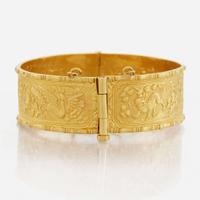 A gold bangle bracelet