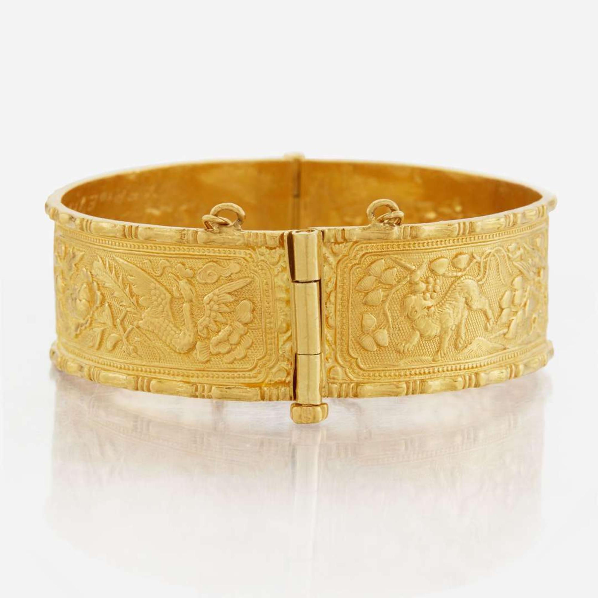 A gold bangle bracelet