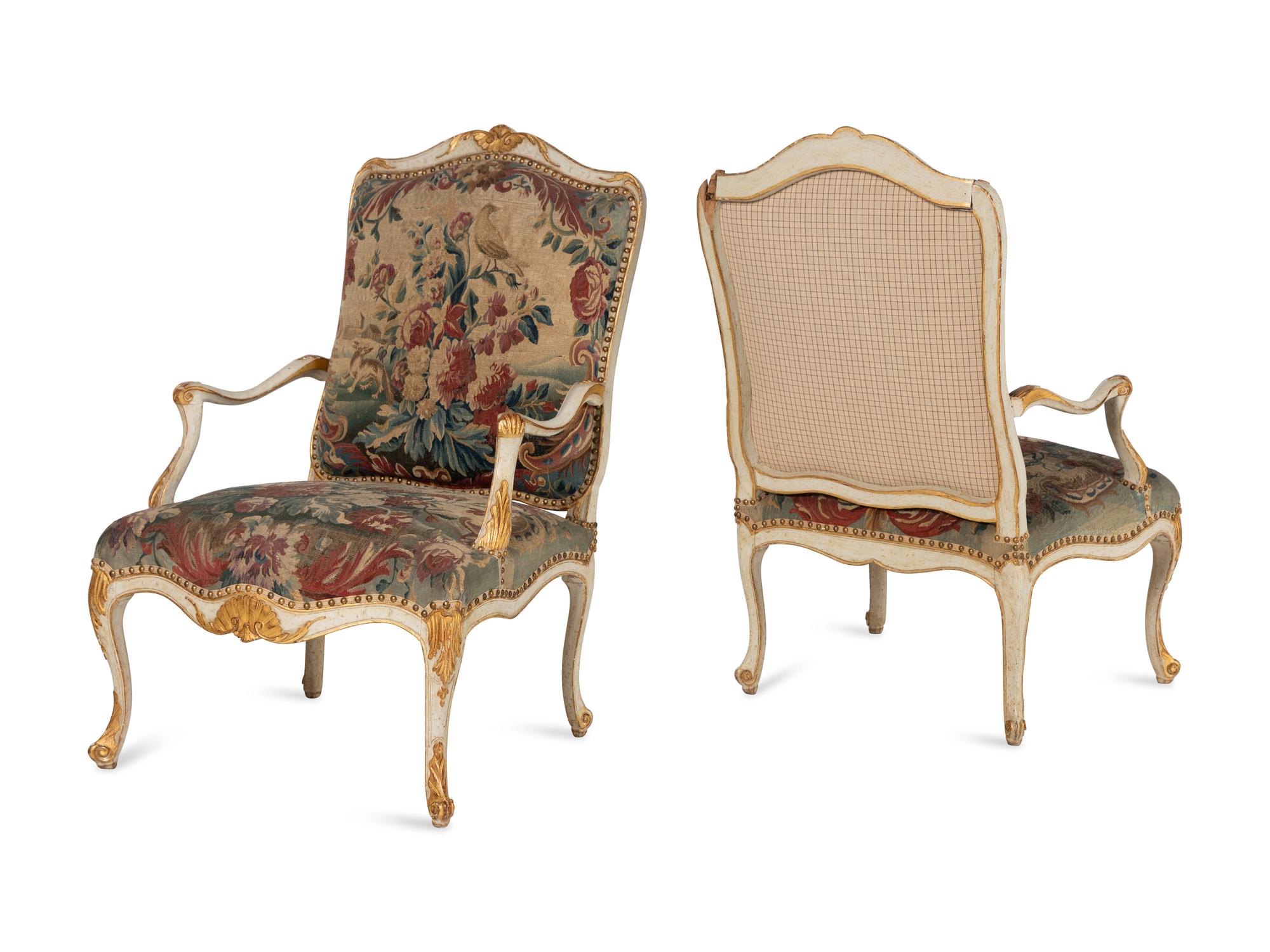 A Set of Four Louis XV White-Painted and Parcel Gilt Tapestry-Upholstered Fauteuils