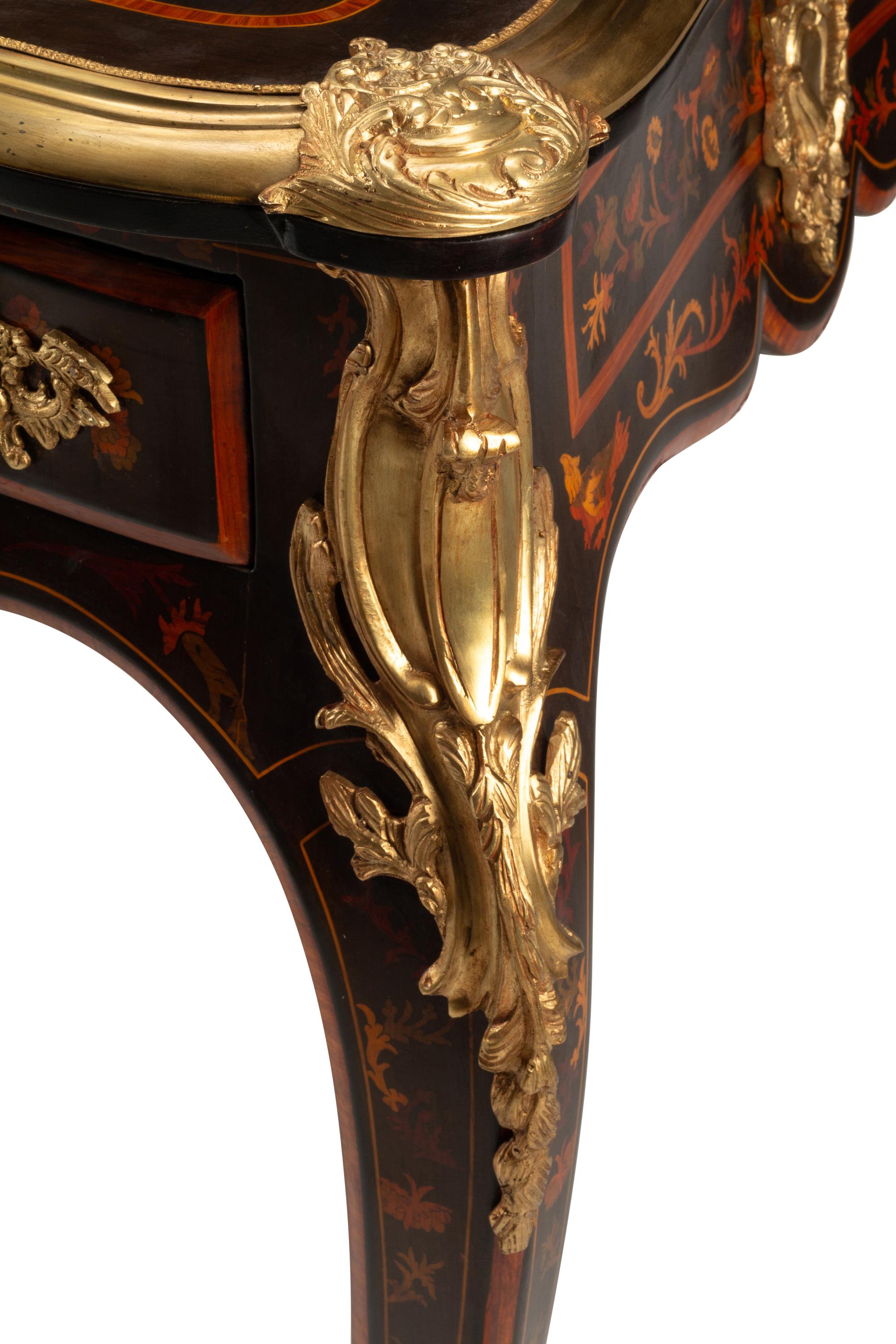 A Louis XV Style Gilt Bronze Mounted Marquetry Bureau Plat