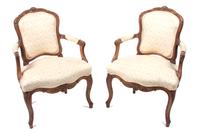 A Set of Four Louis XV Style Fauteuils Height 34 inches.