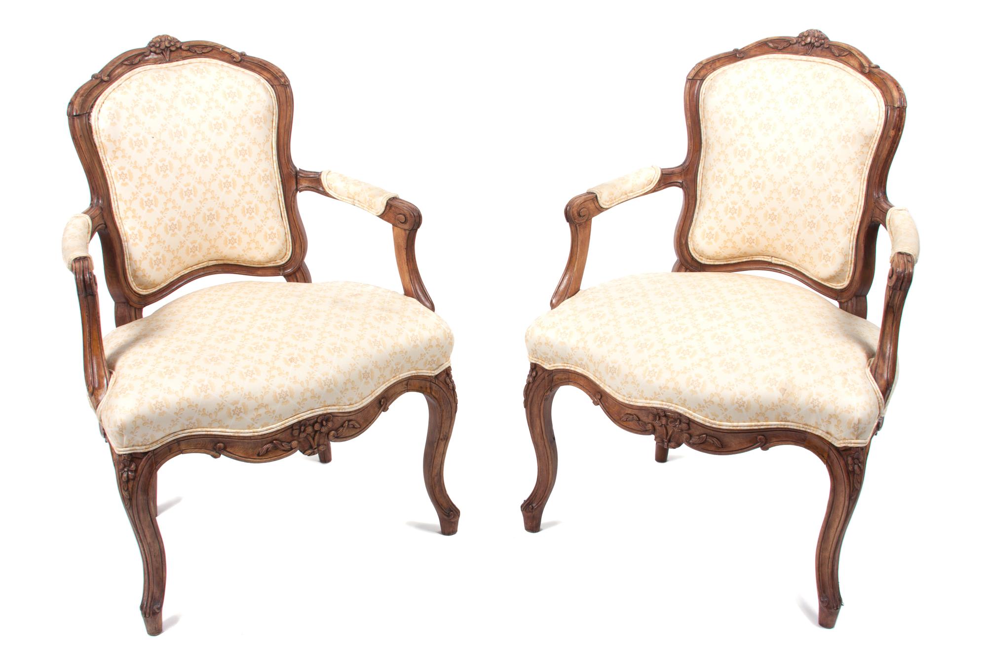 A Set of Four Louis XV Style Fauteuils Height 34 inches.