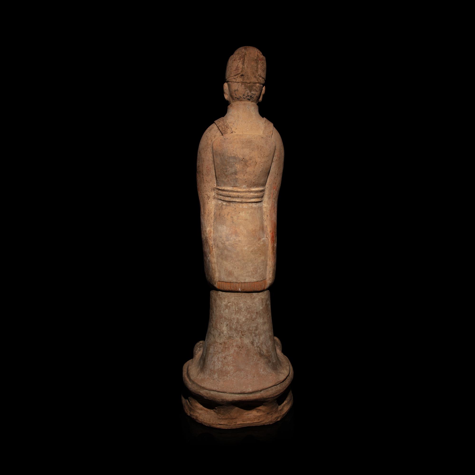 A Chinese Painted Pottery Standing Official, Tang Dynasty — 唐 陶加彩文官俑