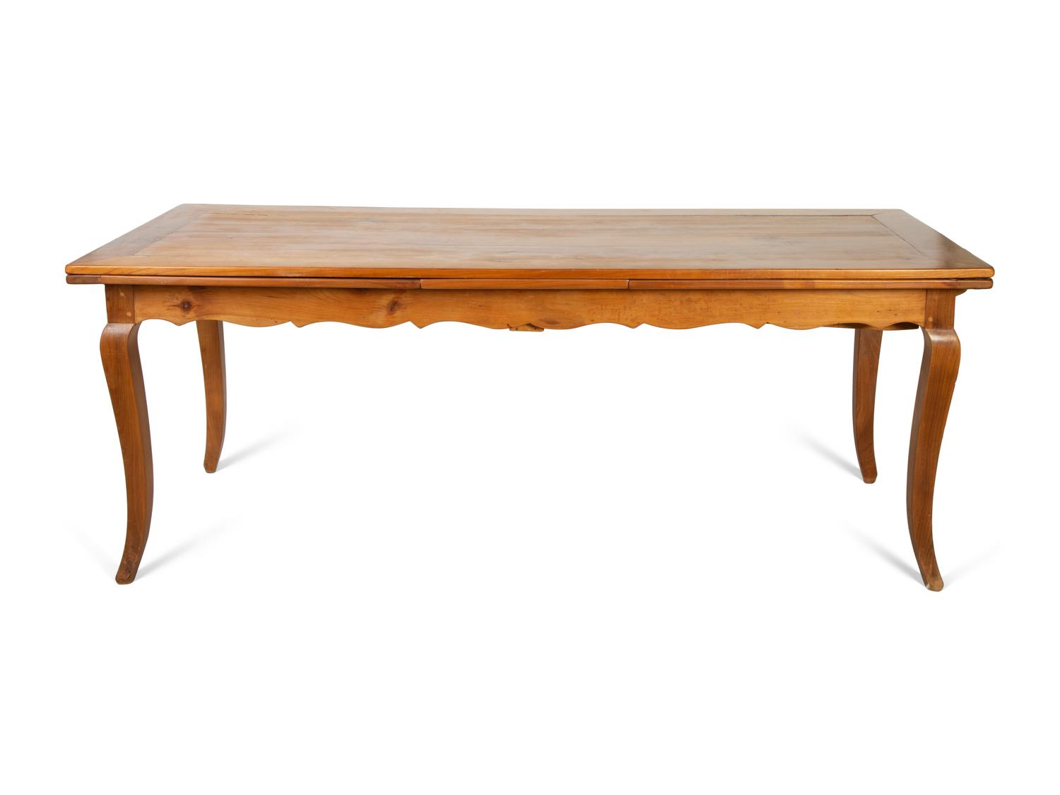 A French Provincial Style Fruitwood Dining Table and Six Side Chairs — 20TH CENTURY