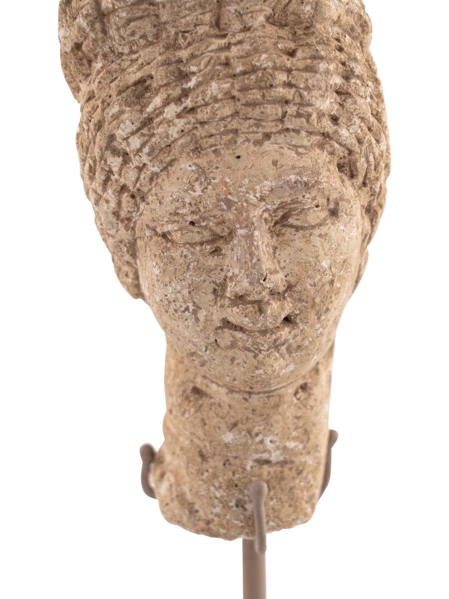 A Roman Stone Head of a Woman