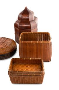 A Collection of Ten Lacquered and Woven Baskets