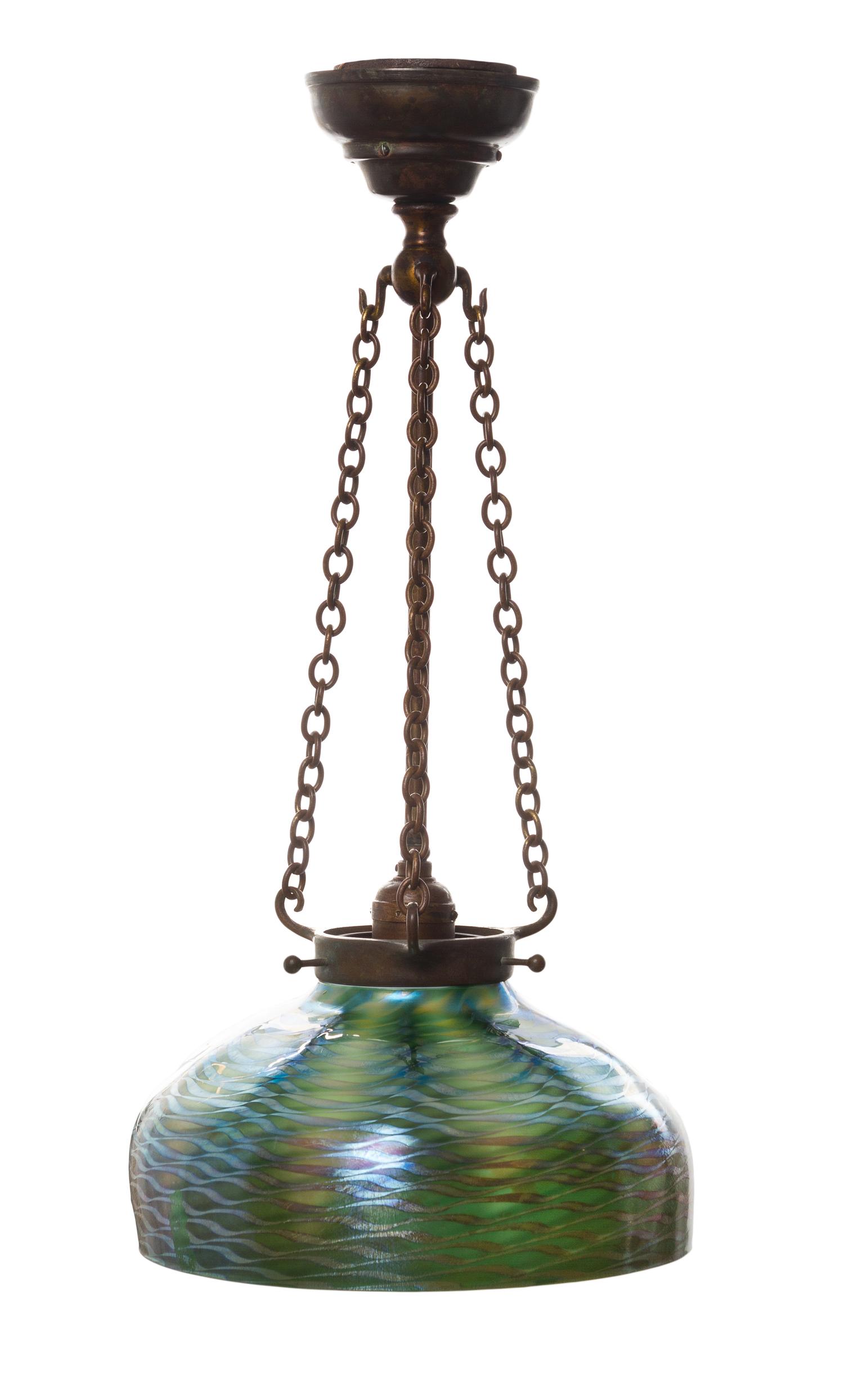 A Tiffany Studios Damascene Favrile Glass and Bronze Fixture Diameter of shade 9 7/8 inches, height overall 20 1/2 inches.