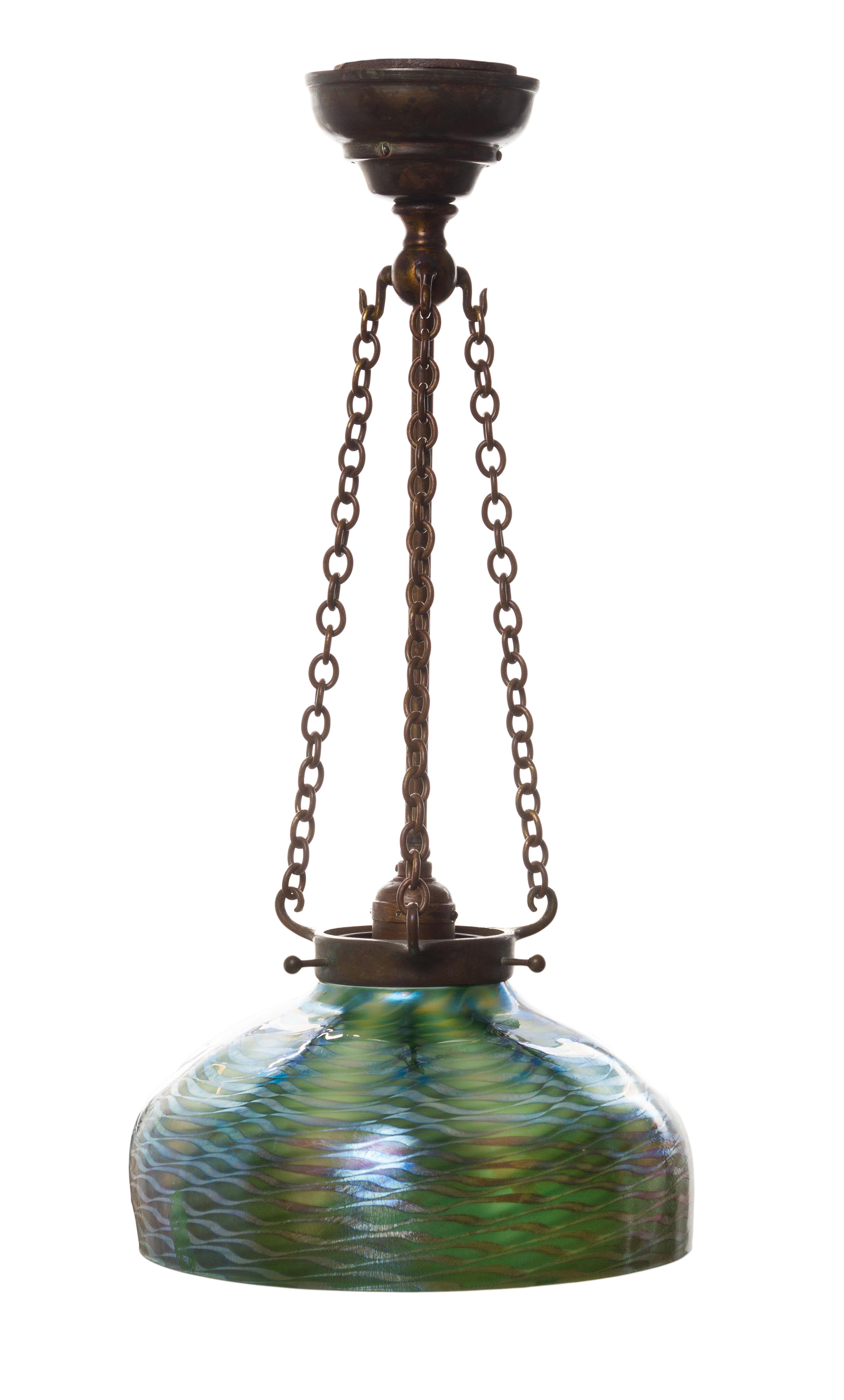 A Tiffany Studios Damascene Favrile Glass and Bronze Fixture Diameter of shade 9 7/8 inches, height overall 20 1/2 inches.