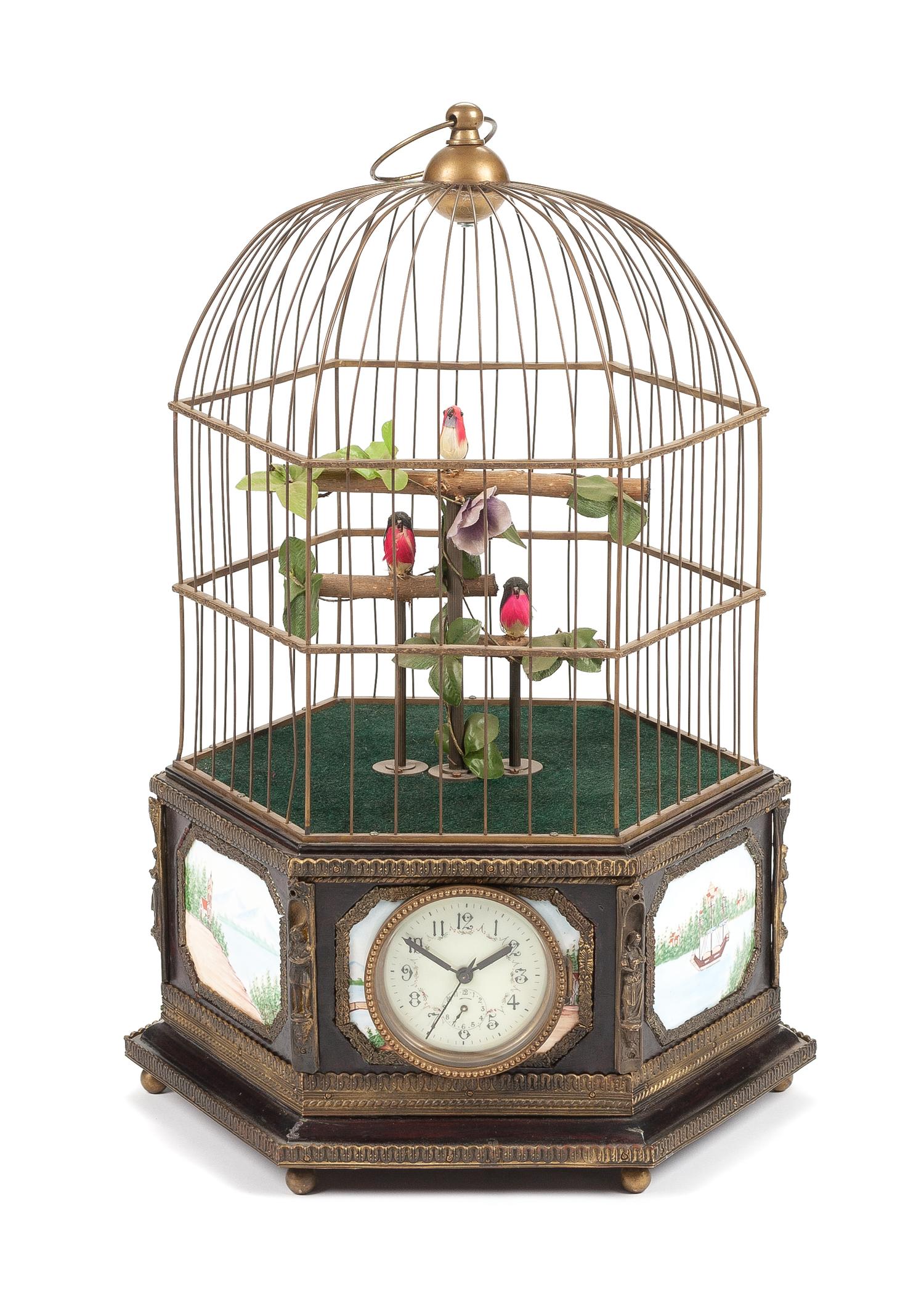 A Continental Porcelain Inset Automaton Birdcage with Clock Height 22 1/2 inches.