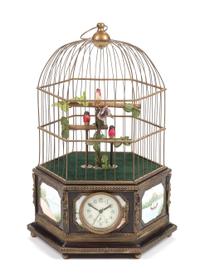 A Continental Porcelain Inset Automaton Birdcage with Clock Height 22 1/2 inches.