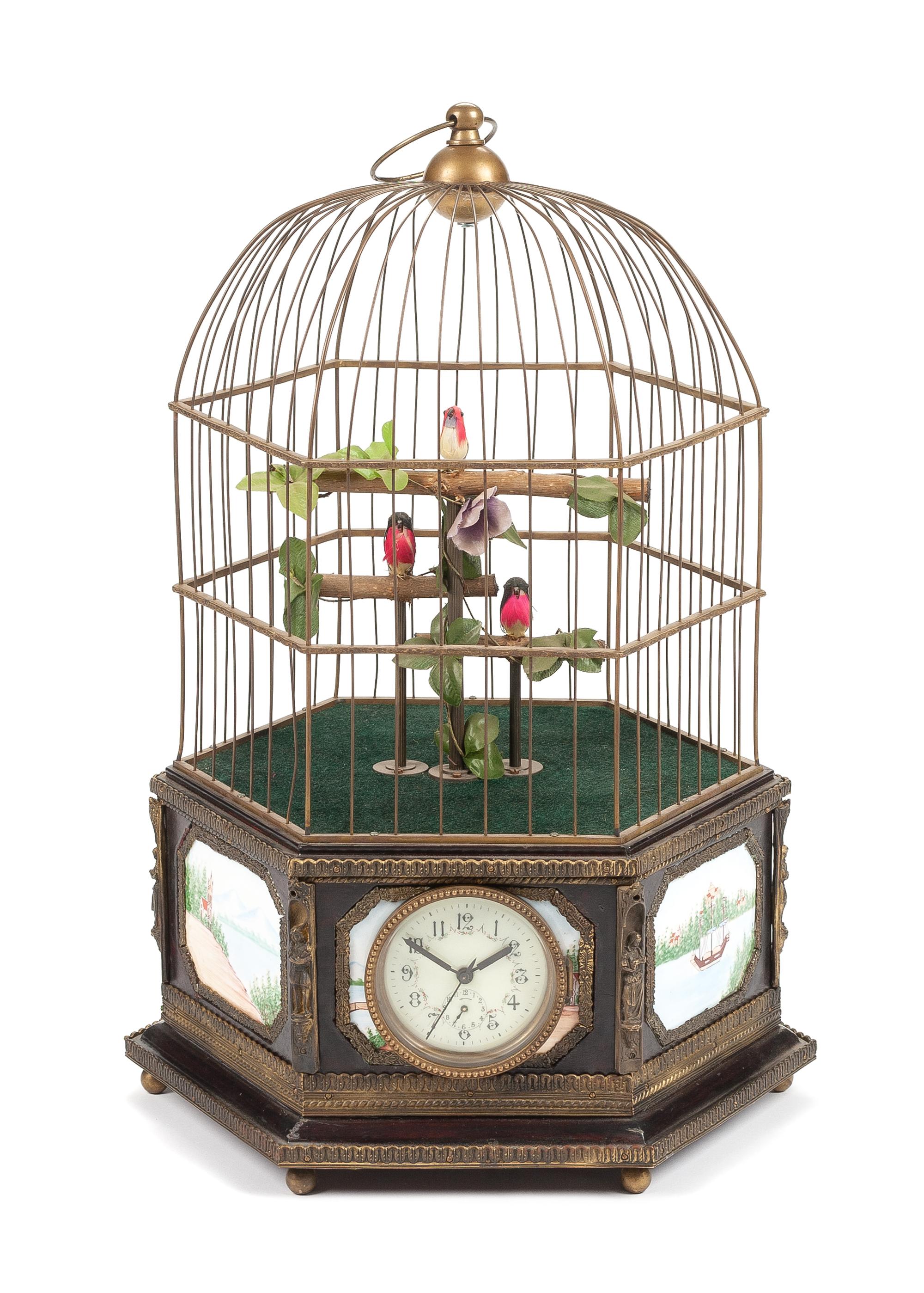 A Continental Porcelain Inset Automaton Birdcage with Clock Height 22 1/2 inches.