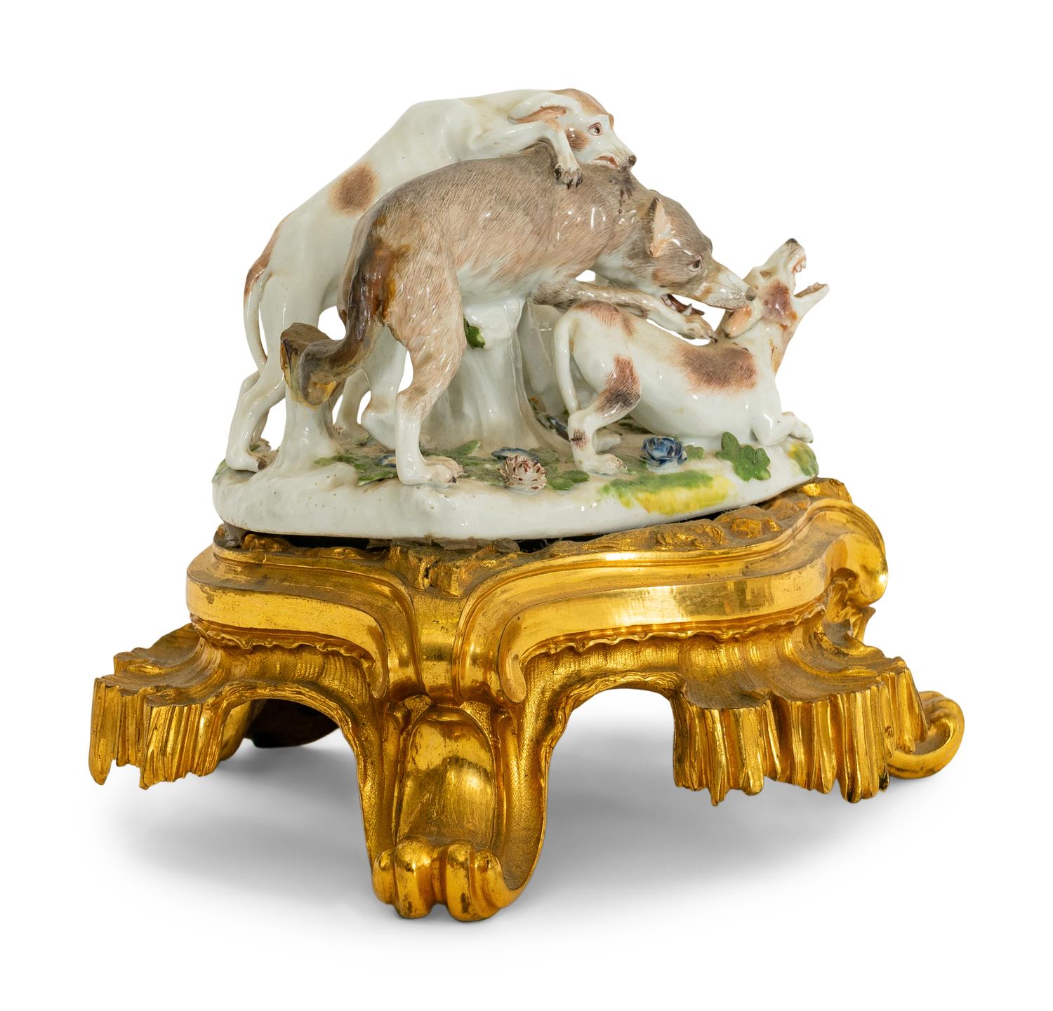 A German Porcelain Hunting Dog and Wolf Group on a Gilt Bronze Stand