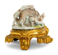 A German Porcelain Hunting Dog and Wolf Group on a Gilt Bronze Stand
