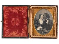 [EARLY PHOTOGRAPHY]. A remarkable ninth plate daguerreotype of an interracial couple.