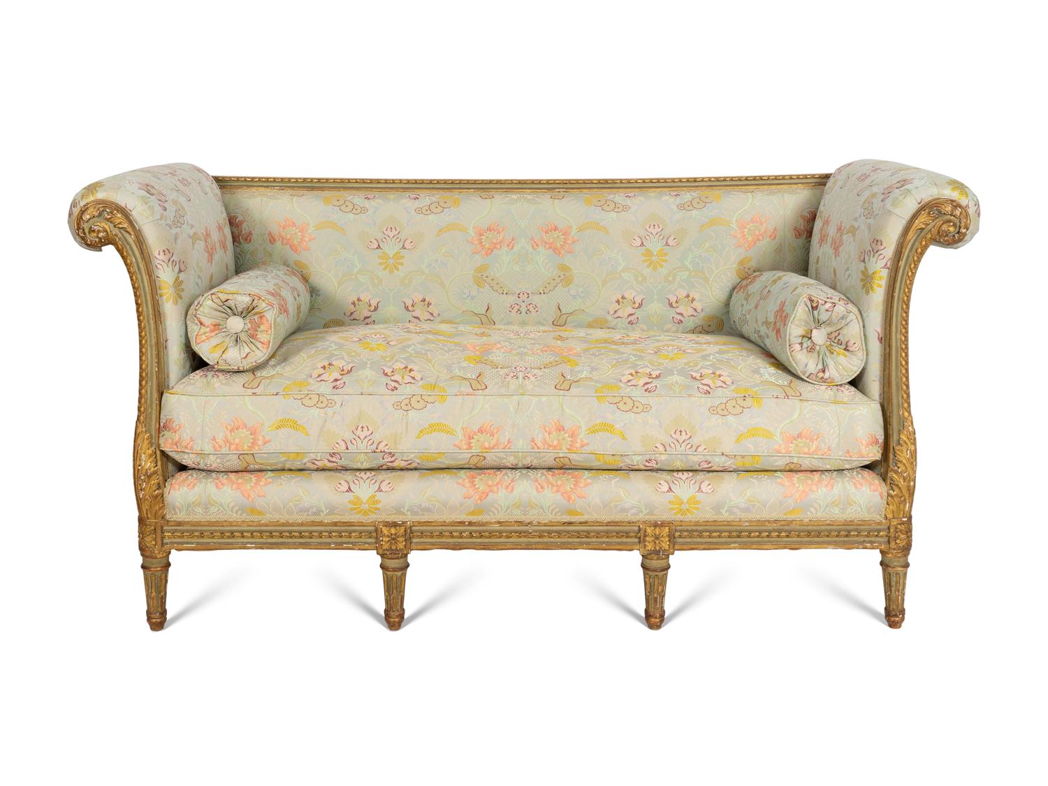 A Louis XVI Style Painted and Parcel Gilt Settee