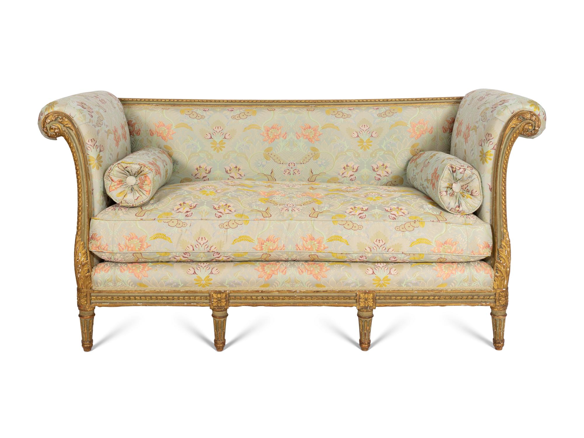 A Louis XVI Style Painted and Parcel Gilt Settee