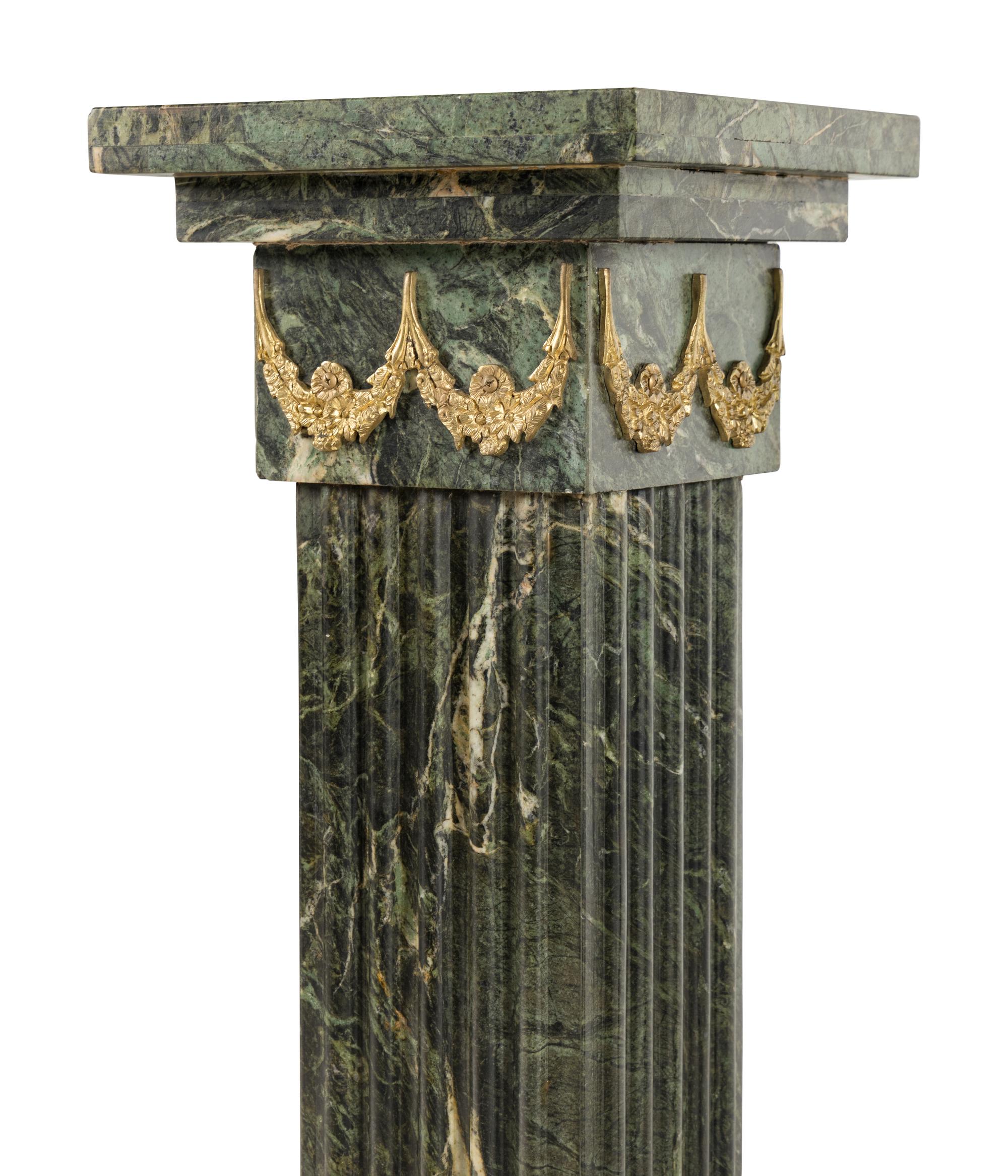 A Pair of Louis XVI Style Gilt Bronze Mounted Marble Pedestals