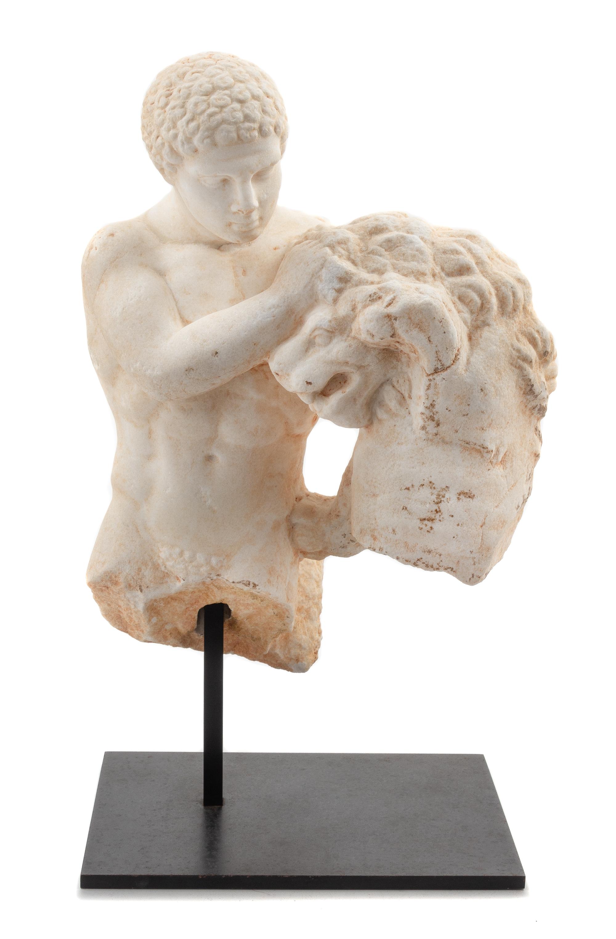 A Roman Marble Figure of Heracles with the Nemean Lion Height 17 1/2 inches. — CIRCA 1ST-2ND CENTURY B.C.E.