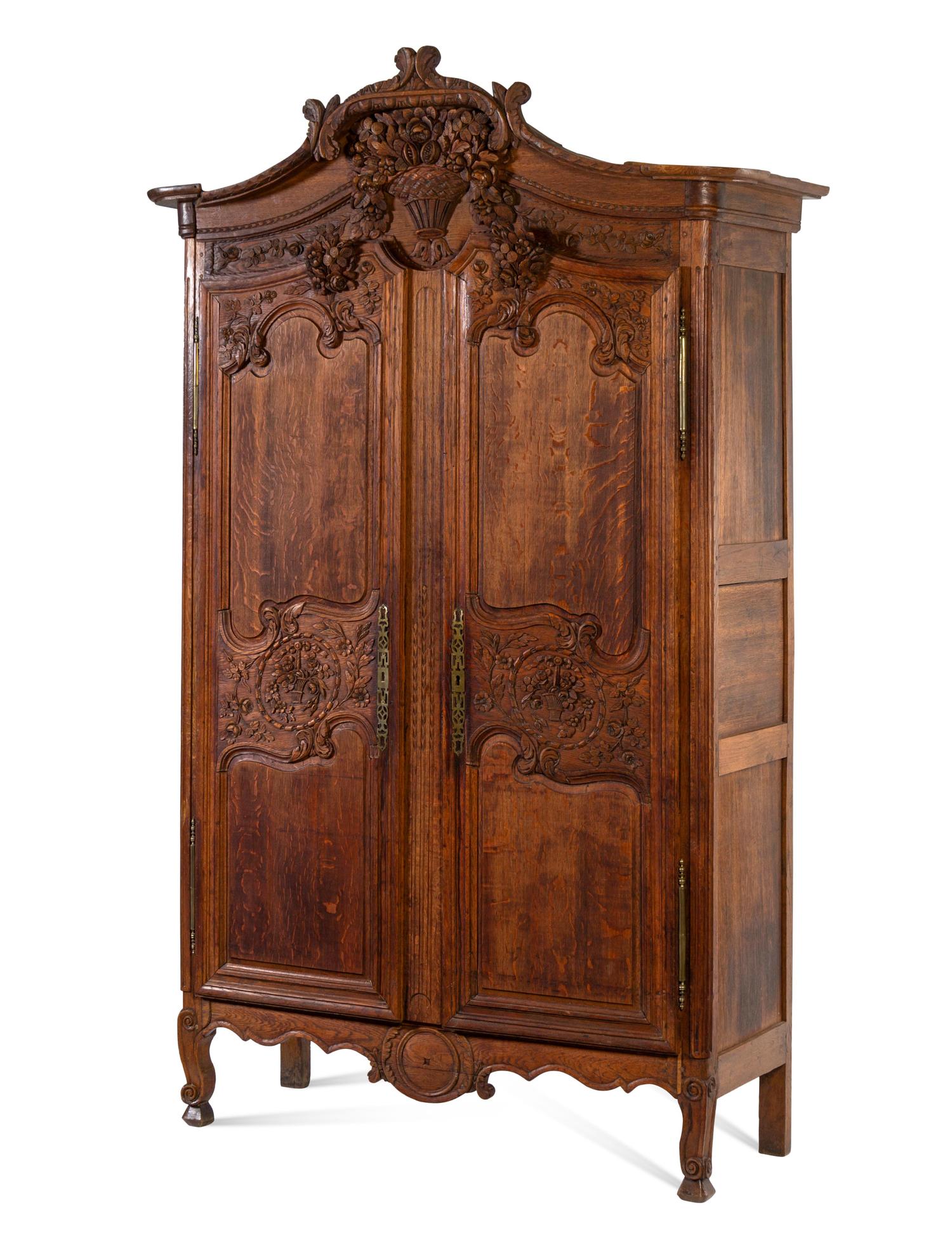 A French Provincial Carved Oak Armoire