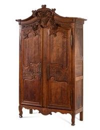 A French Provincial Carved Oak Armoire