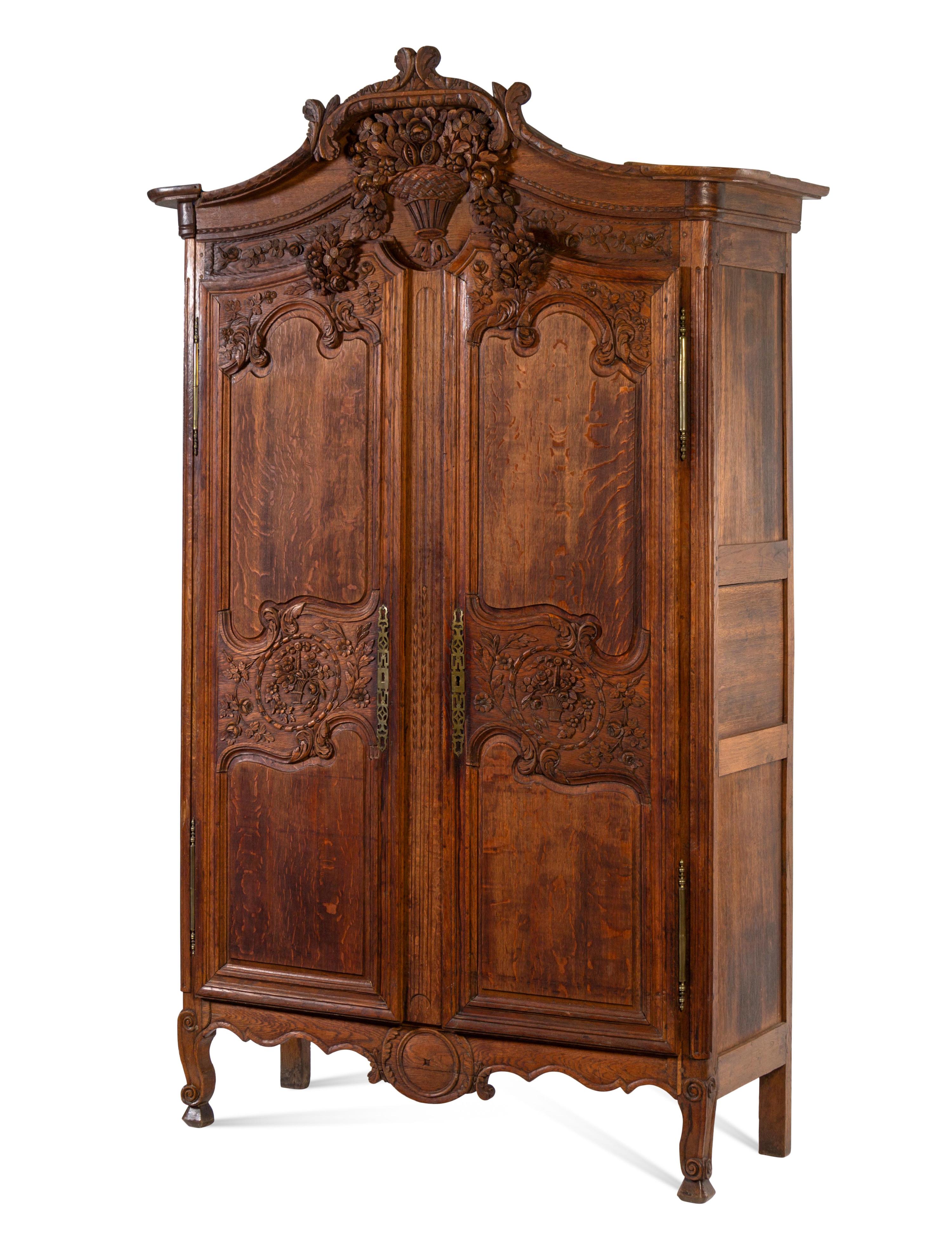 A French Provincial Carved Oak Armoire