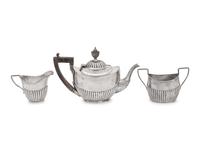 An Assembled Edwardian Silver Three-Piece Bachelor's Tea Service
