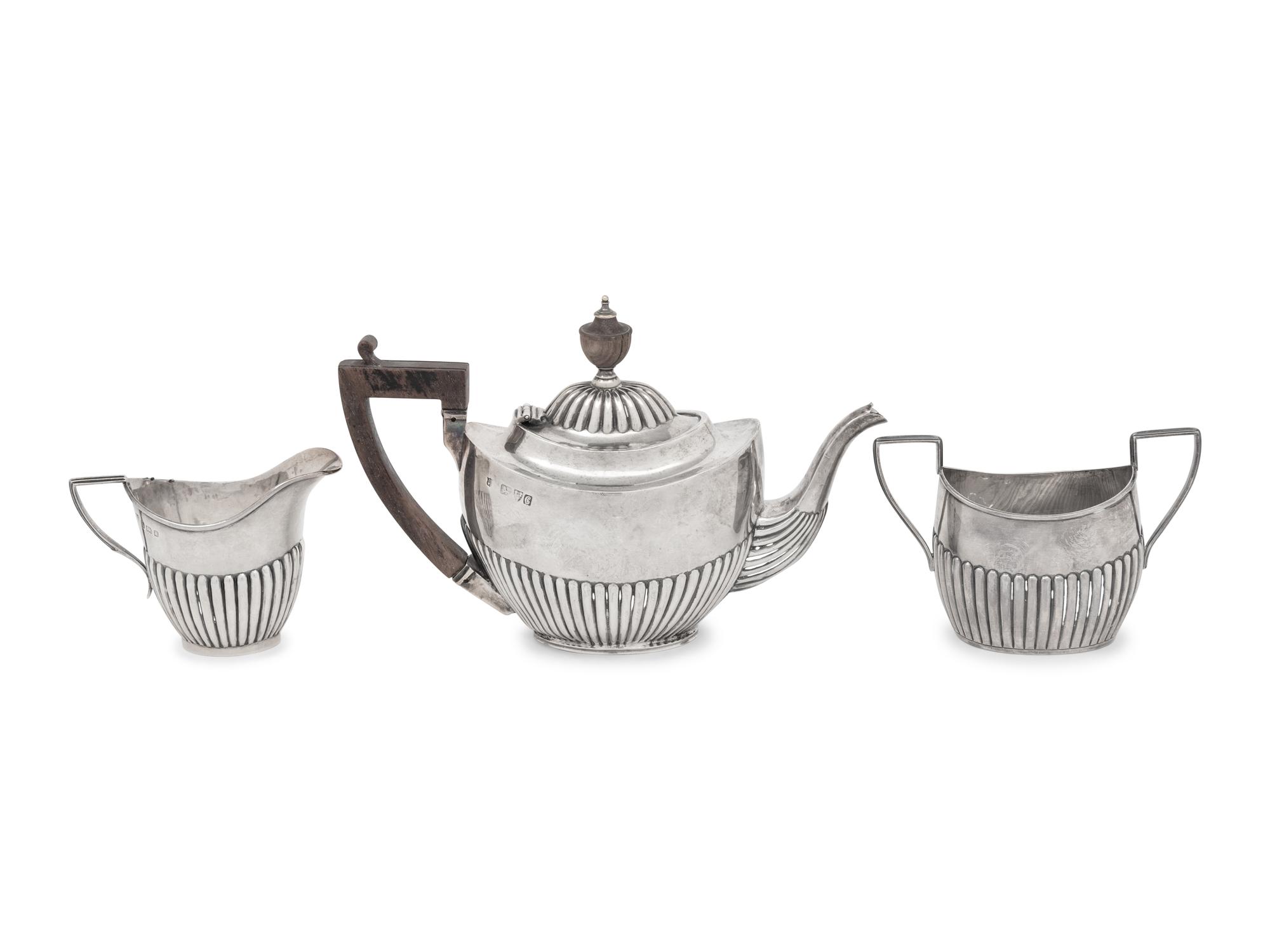 An Assembled Edwardian Silver Three-Piece Bachelor's Tea Service