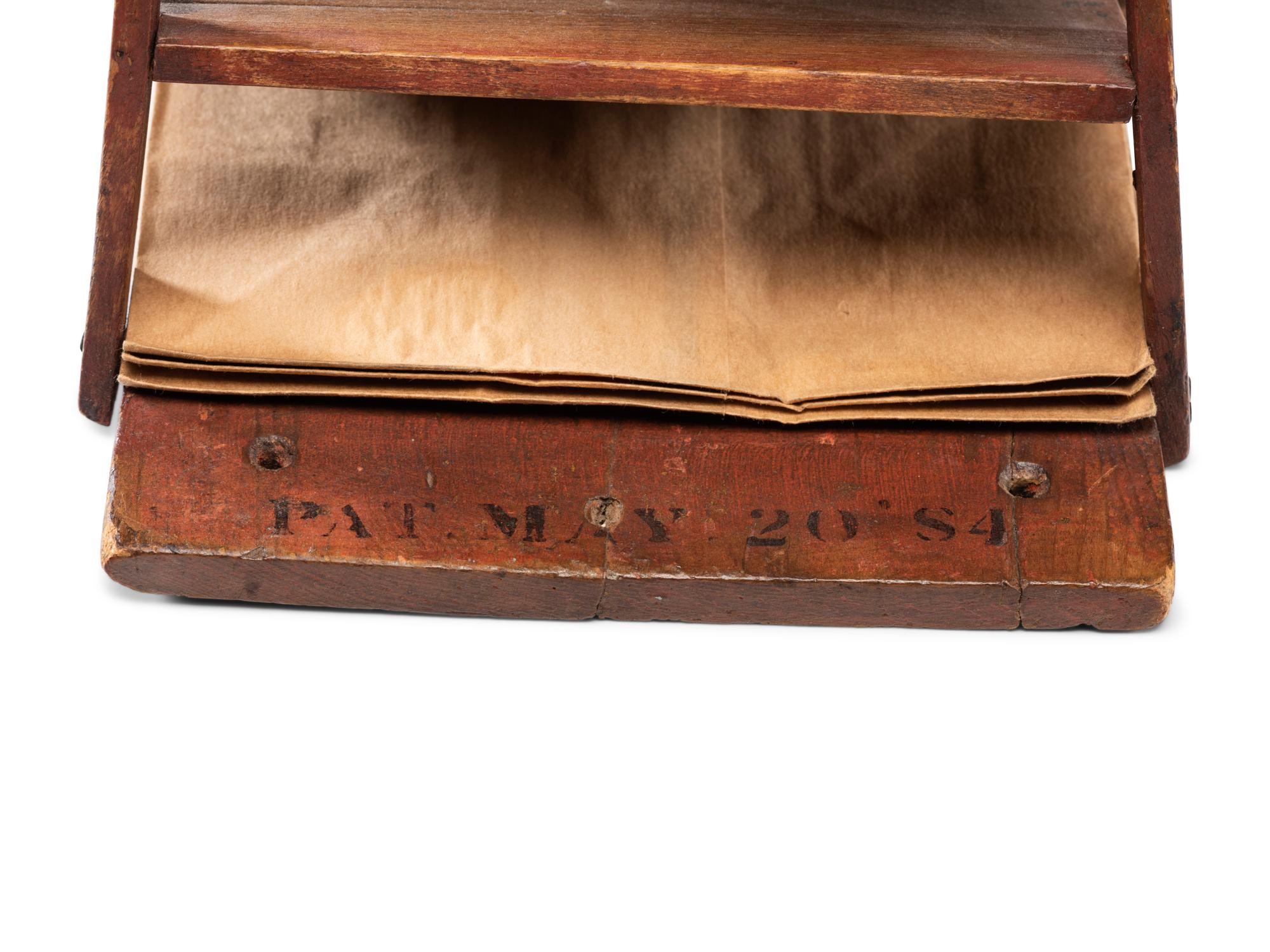 A Stenciled Wood Stratton & Bird Countertop Bag Rack