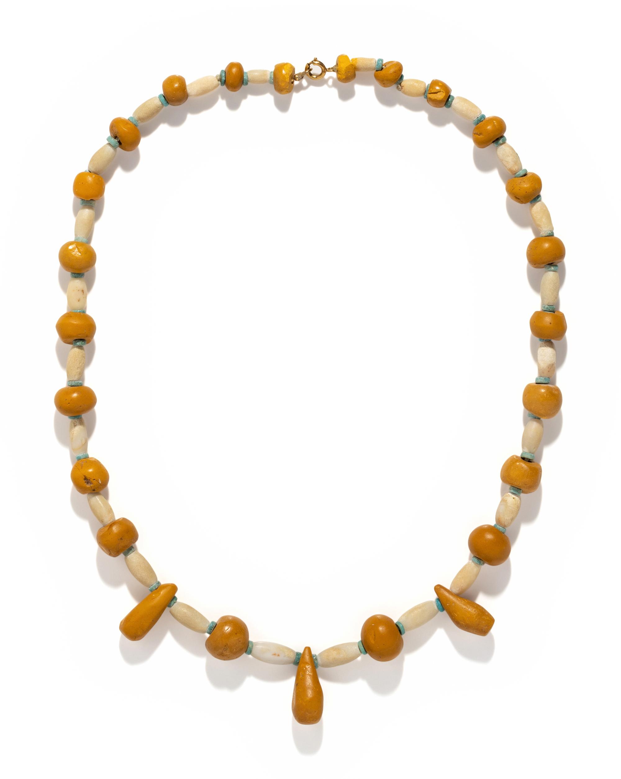 A Near Eastern Carnelian, Quartz, and Faience Bead Necklace