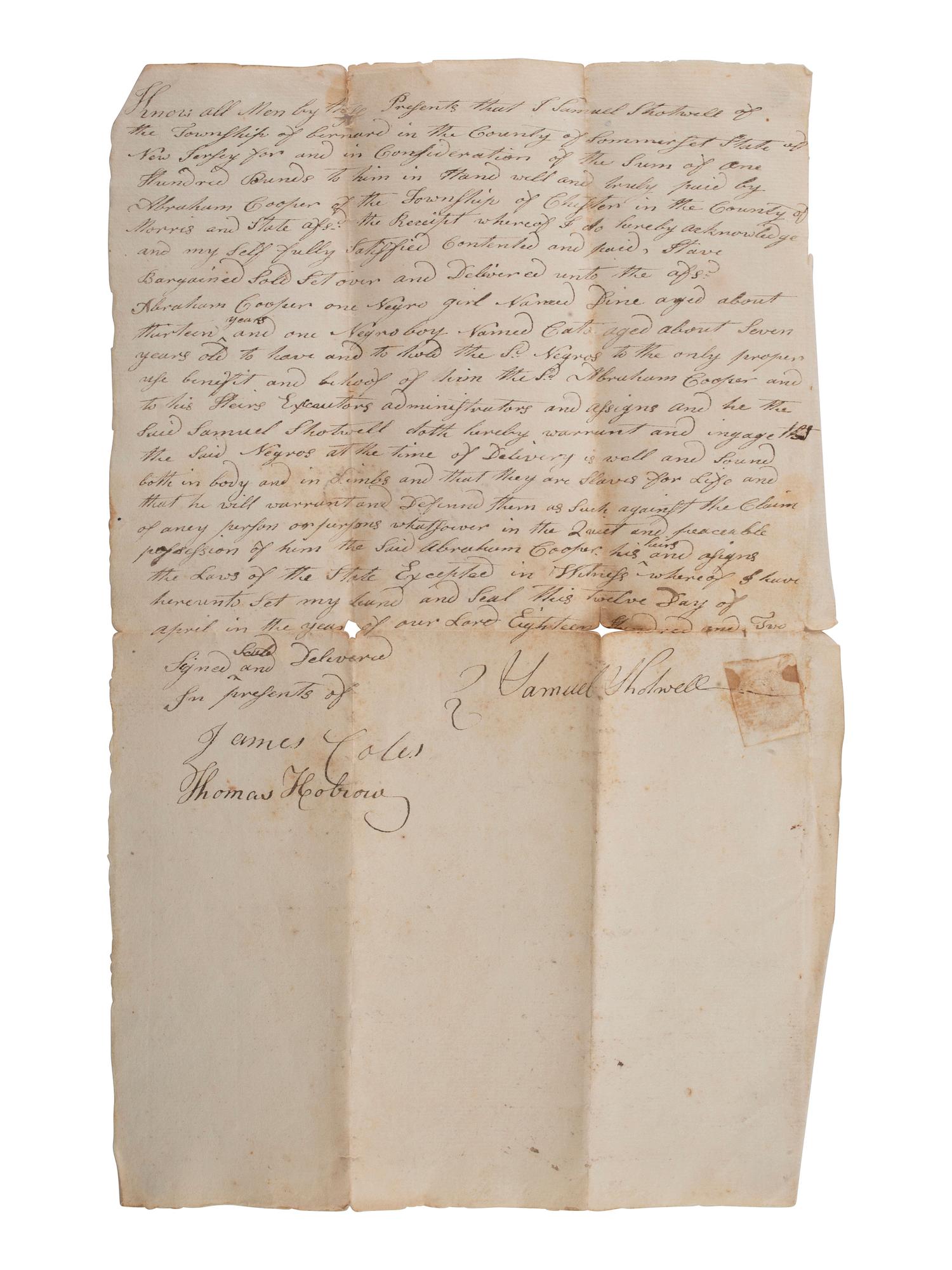 [SLAVERY & ABOLITION]. Manuscript bill of sale for two enslaved individuals, Dine and Cato. New Jersey, 12 April 1802.