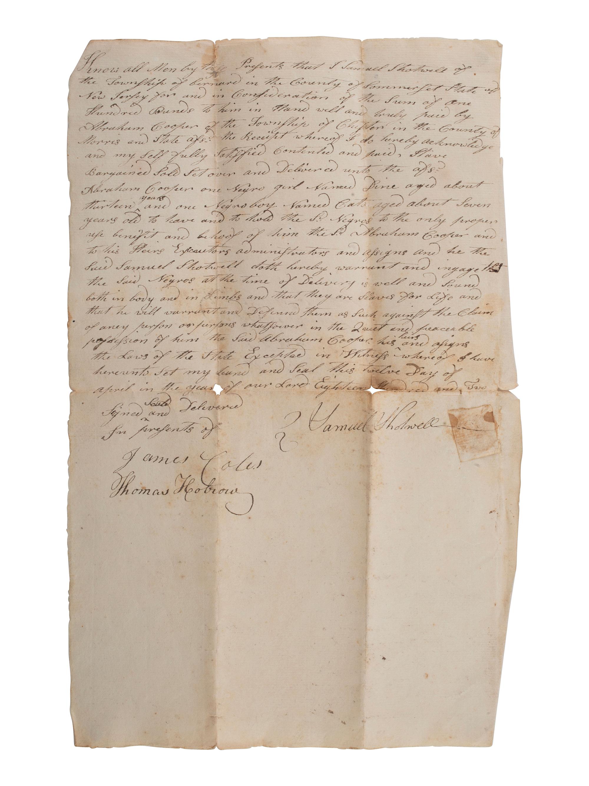 [SLAVERY & ABOLITION]. Manuscript bill of sale for two enslaved individuals, Dine and Cato. New Jersey, 12 April 1802.
