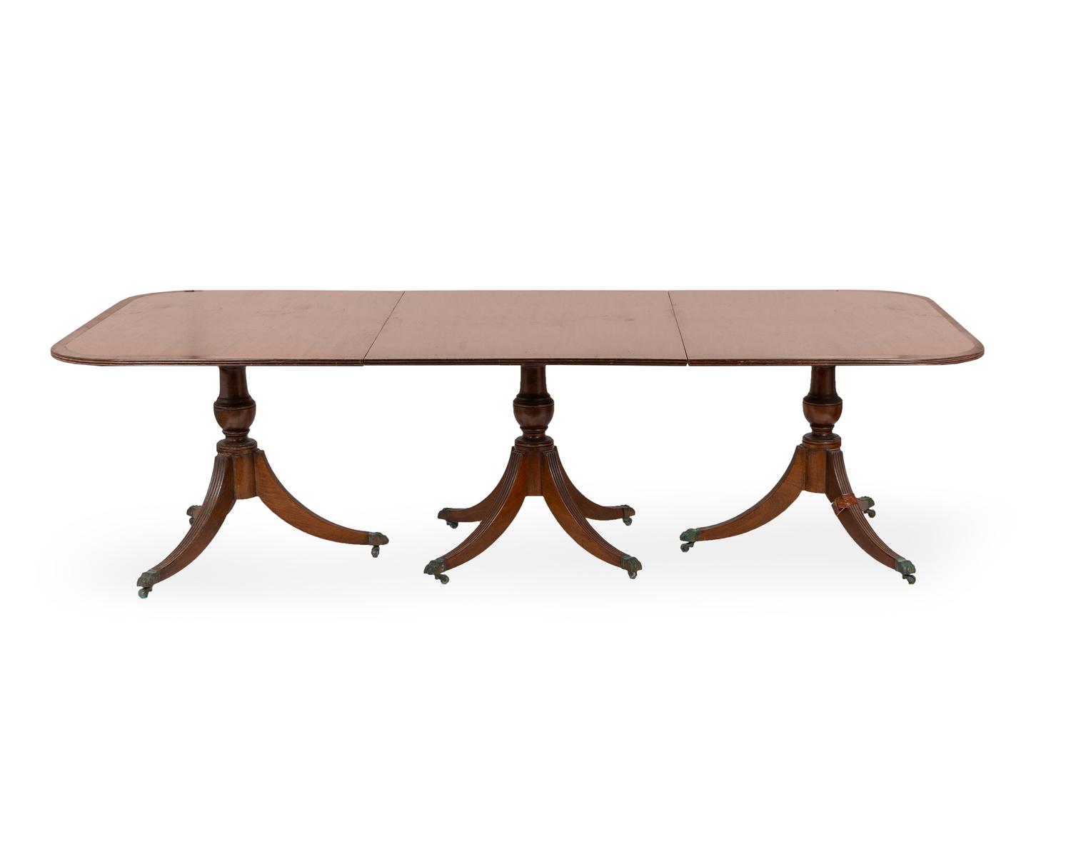 A Regency Style Mahogany Three-Pedestal Dining Table — 20TH CENTURY