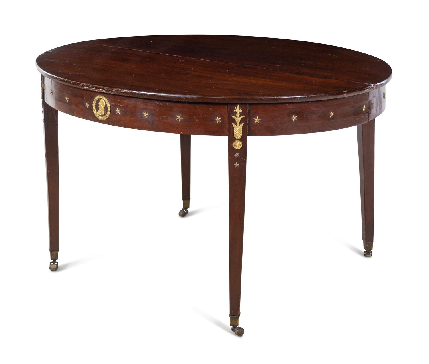 An Assembled Empire Style Gilt Metal Mounted Mahogany Dining Suite