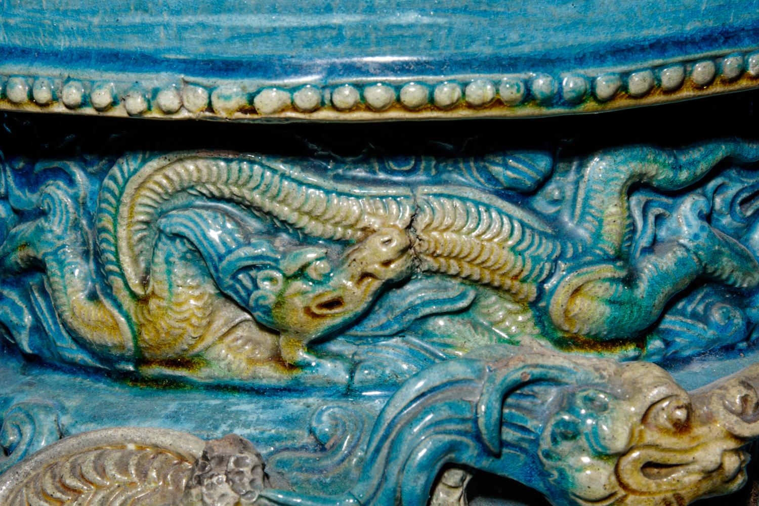 A Turquoise and Ochre Glazed Tileworks Tripod Incense Burner