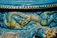 A Turquoise and Ochre Glazed Tileworks Tripod Incense Burner