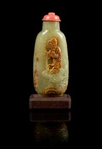 A Carved Jade Snuff Bottle Height 3 1/4 inches (with stand).