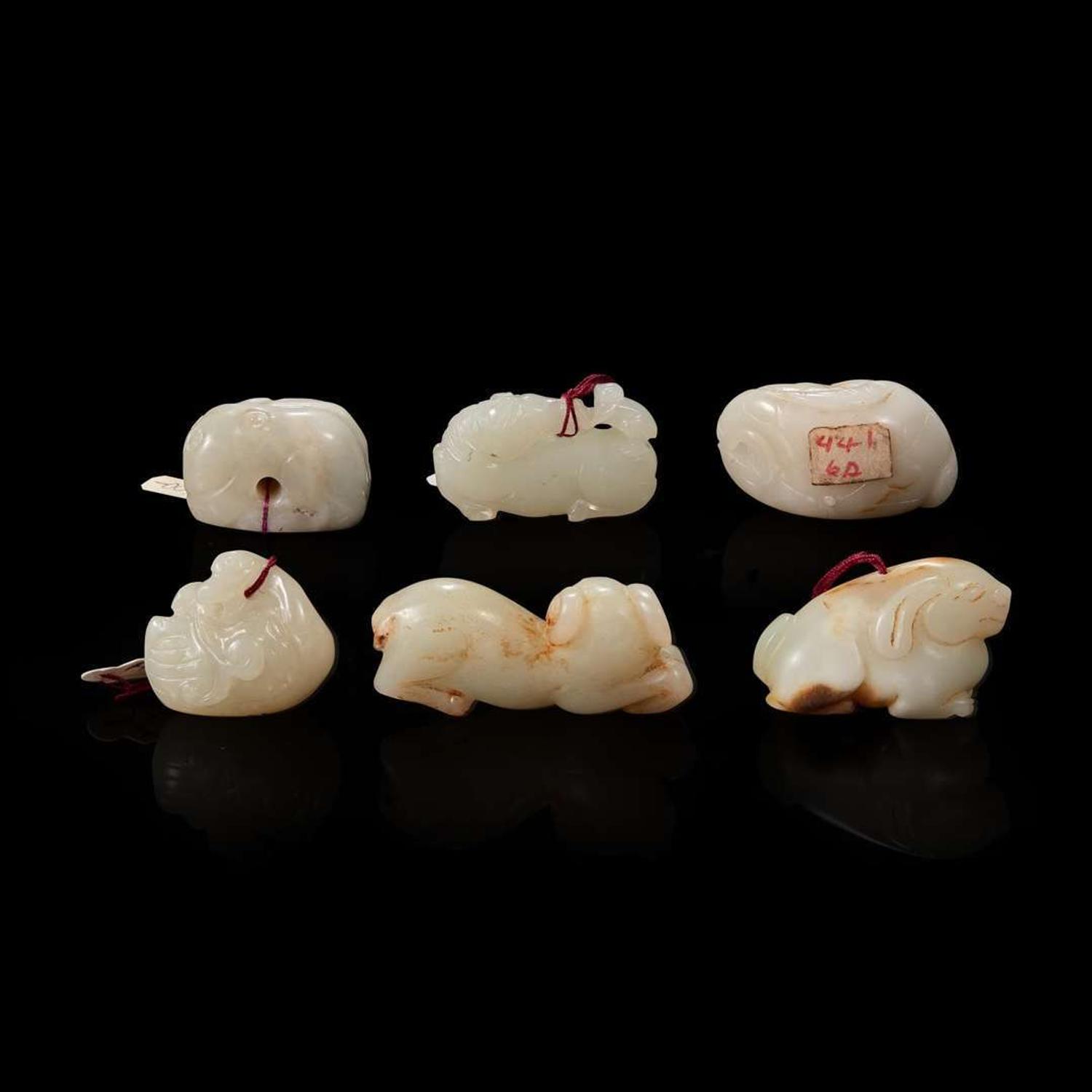 Group of six small white jade animal-form pendants
