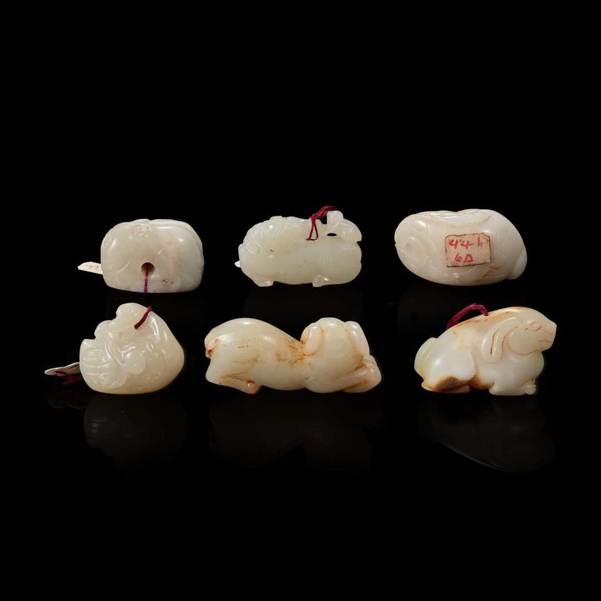 Group of six small white jade animal-form pendants