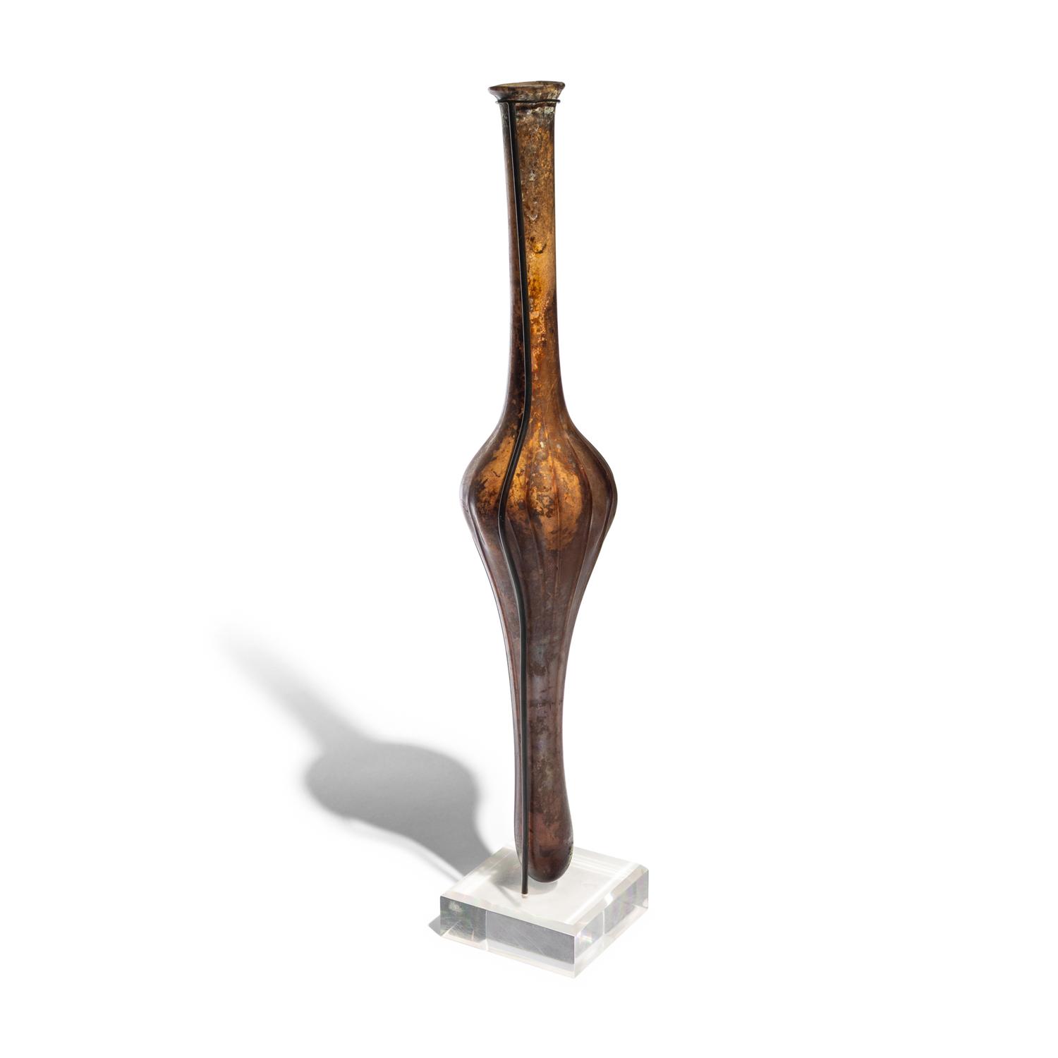 A Roman Aubergine Glass Unguentarium