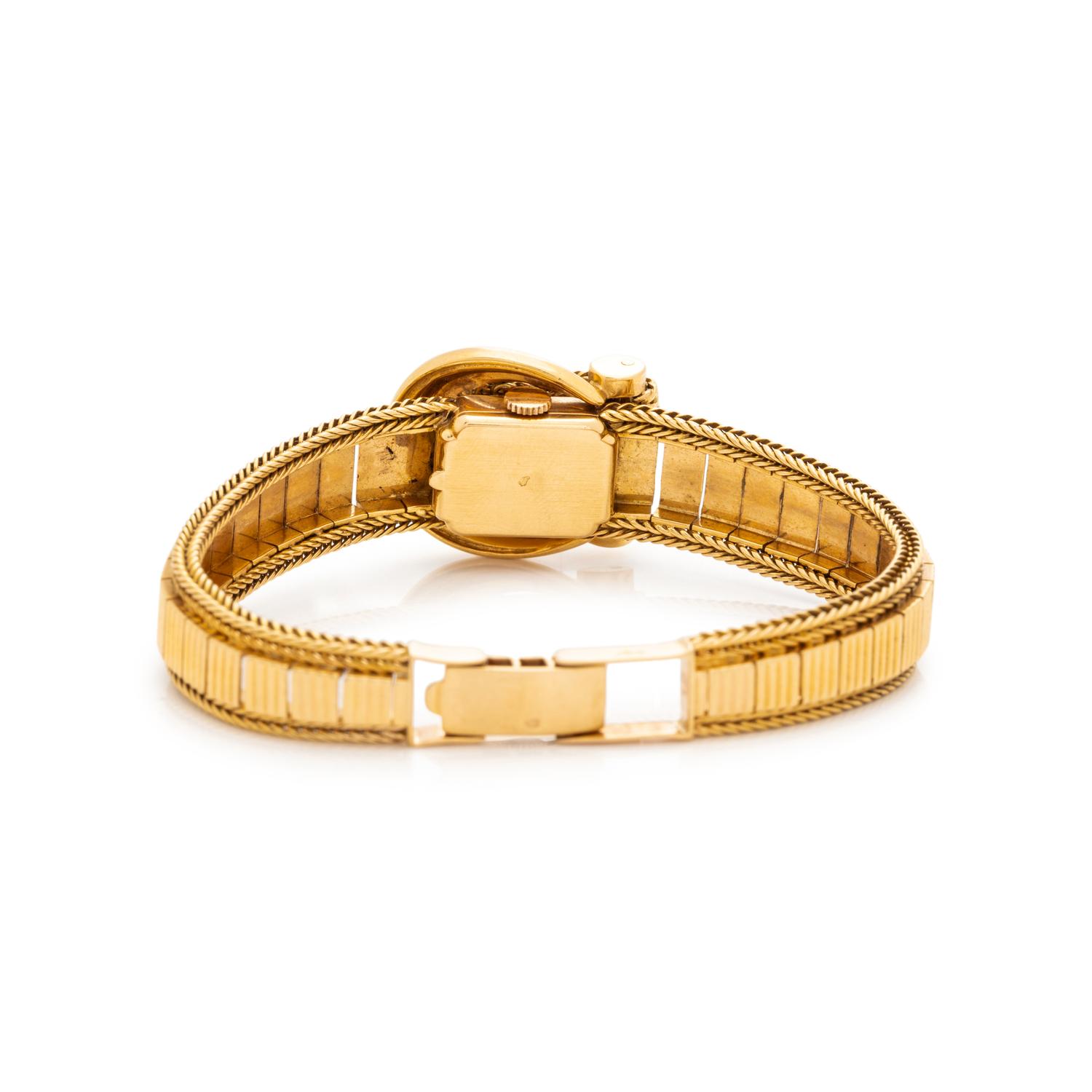 MOVADO, 18K YELLOW GOLD SURPRISE WATCH