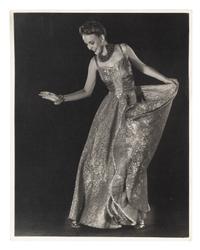 Model wearing evening dress of net skirt with silver metal bodice and Model wearing gold brocade evening dress (two works), 1938; printed ca. 1938