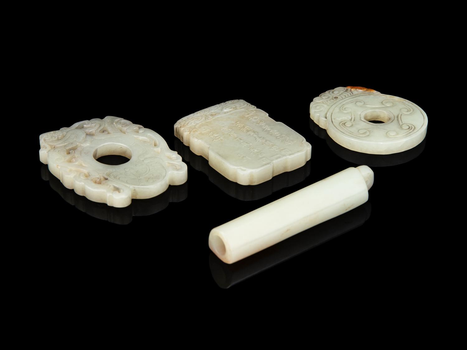 Four Chinese Carved Celadon Jade Pendants