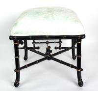 An Eastlake Style Ebonized and Gilt Decorated Stool, Baker Height 18 x width 17 x depth 17 inches.
