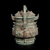 A Chinese archaistic bronze covered ritual wine vessel, You 青銅提梁卣